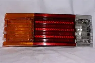 FAROL TRA VW BRASILIA (TRICOLOR) (CENTRAL)